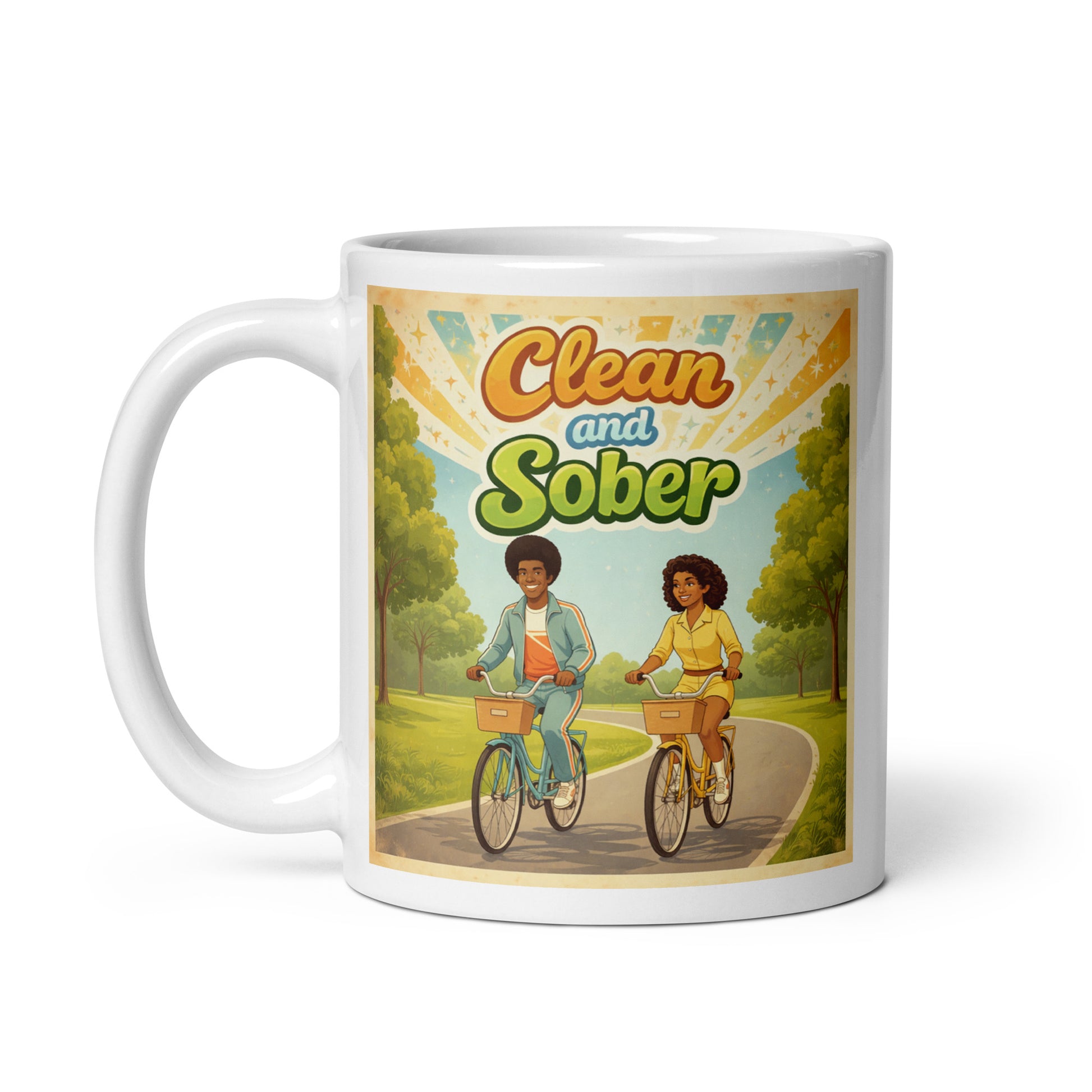 Mug with illustration of two sober people riding bicycles and 'Clean and Sober' text on a scenic background.
