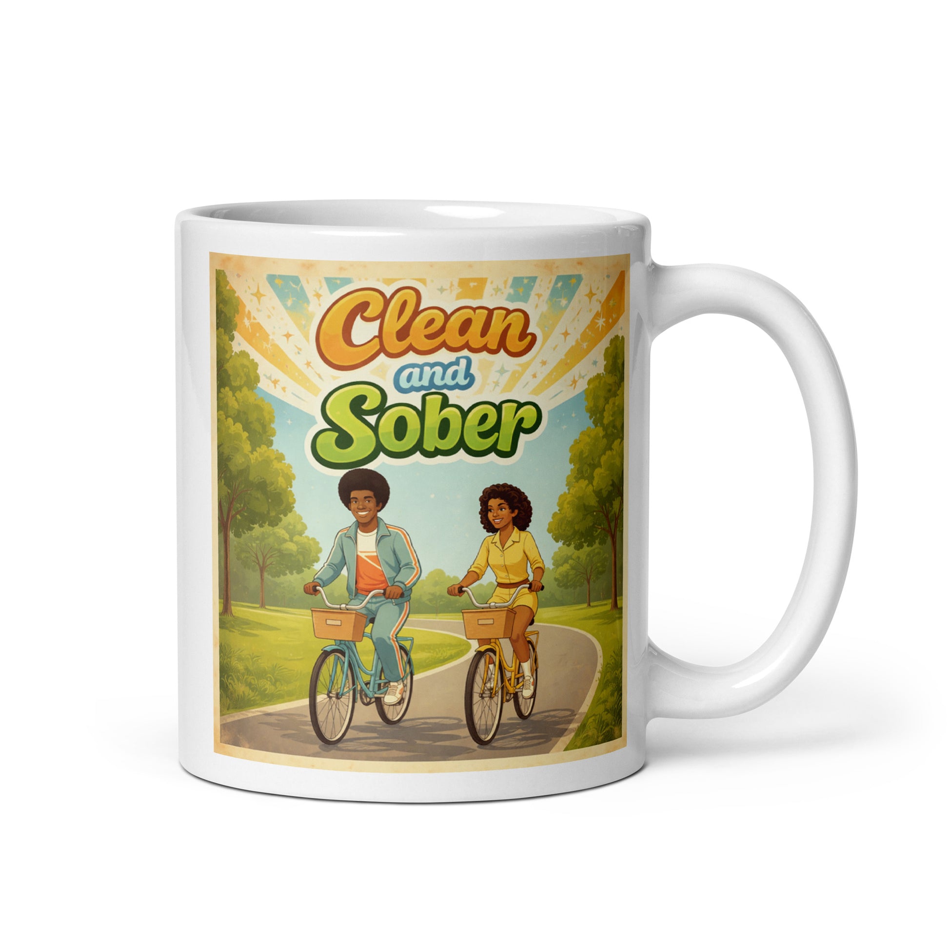Mug with illustration of two people riding bicycles and text 'Clean and Sober' on a scenic background.