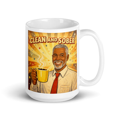 Mug with a graphic of a man holding a coffee cup and the text 'Clean and Sober' on a white background. Yellow, orange and red.