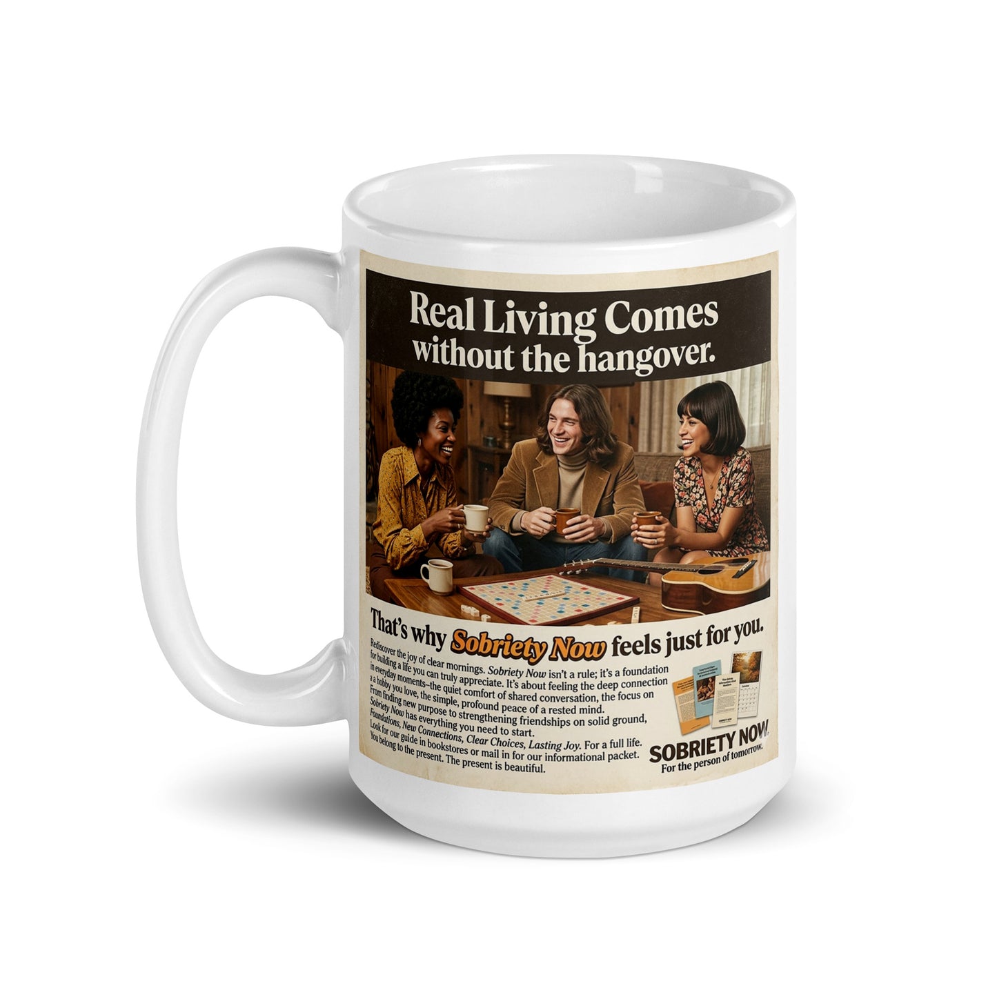 Mug with a graphic of people playing dominoes and text about sobriety, on a white background. Real living comes without the hangover.