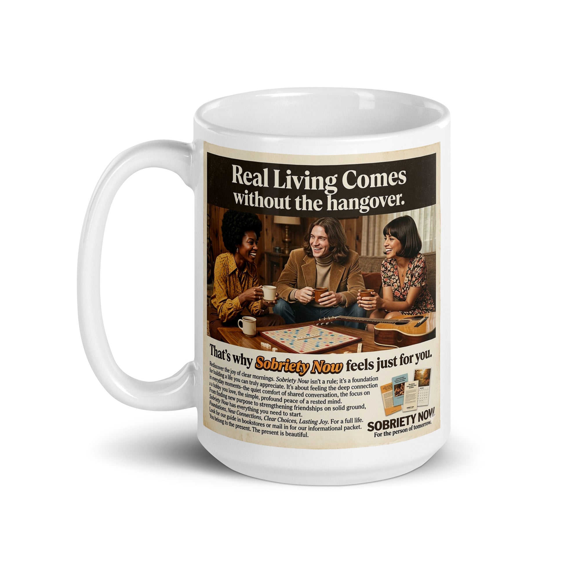 Mug with a graphic of people playing dominoes and text about sobriety, on a white background. Real living comes without the hangover.