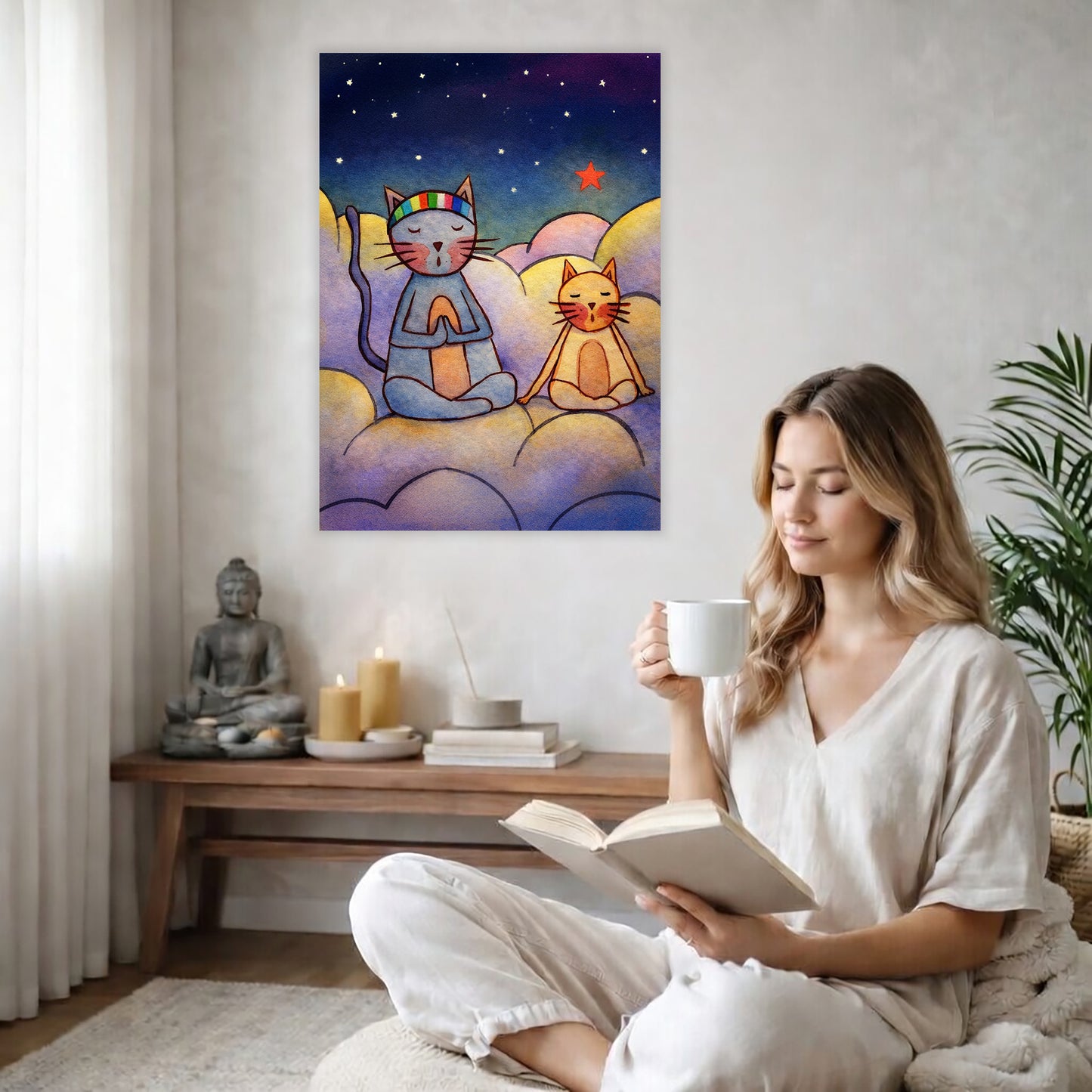 Gray and orange cats meditating together on a cloud at night under a starry sky. The poster is in the center of the living room wall. There is a coffee table below the poster with burning candles. A woman is sitting in a wicker chair on the right side of the poster with a cup of tea reading a book.