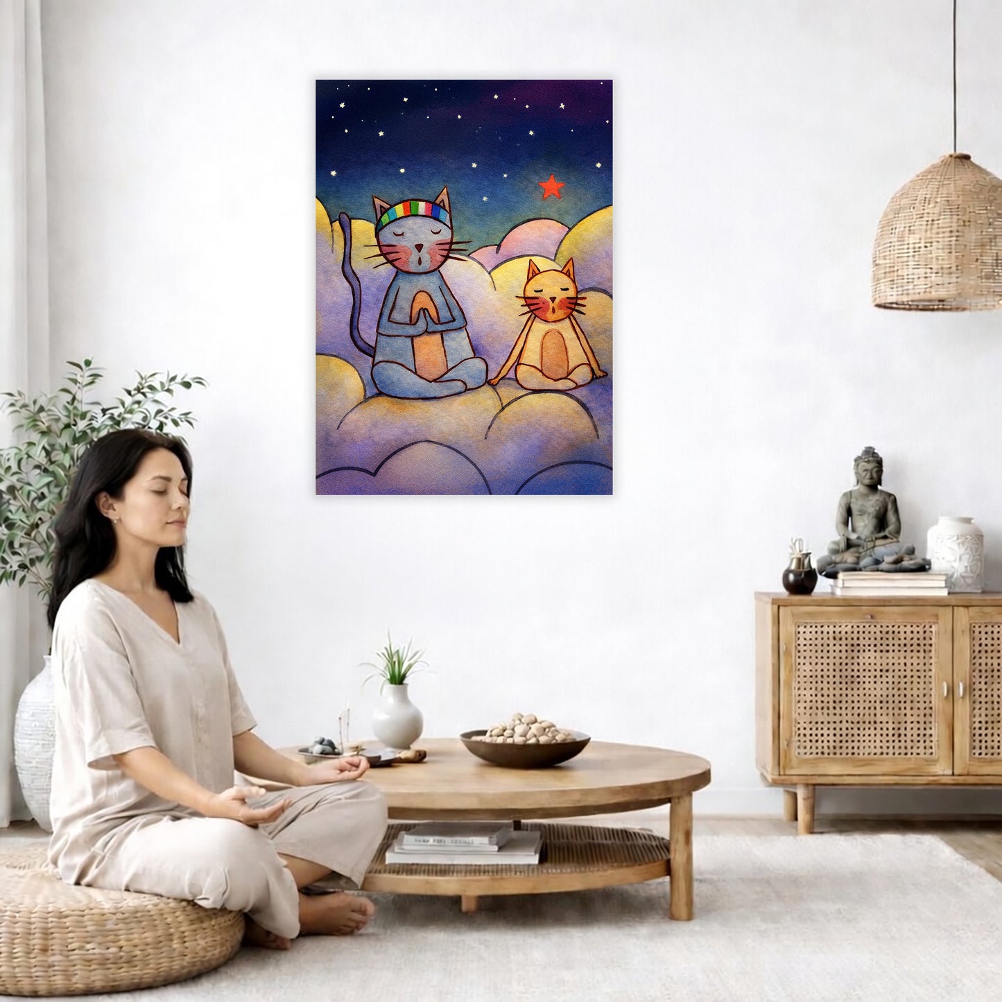 Gray and orange cats meditating together on a cloud at night under a starry sky.  The poster is in the center of the living room wall. A woman is on a chair on the left side of his living room meditating. There is a green potted plant behind her. On the right side is a cabinet with a Buddha statue on it.
