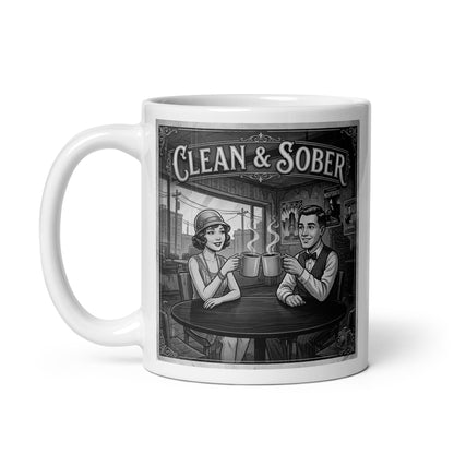 Beautiful and striking Black and white vintage illustration coffee mug featuring a 1920s flapper woman and dapper man clinking coffee mugs in a café with silent film movie posters on the wall and "Clean & Sober" in marquee lettering overhead
