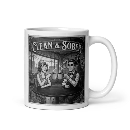 Black and white vintage illustration coffee mug featuring a 1920s flapper woman and dapper man clinking coffee mugs in a café with silent film movie posters on the wall and "Clean & Sober" in marquee lettering overhead