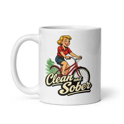 Peppy 1950s retro clean and sober coffee mug design featuring a smiling woman riding a red bicycle with bold vintage sobriety lettering.