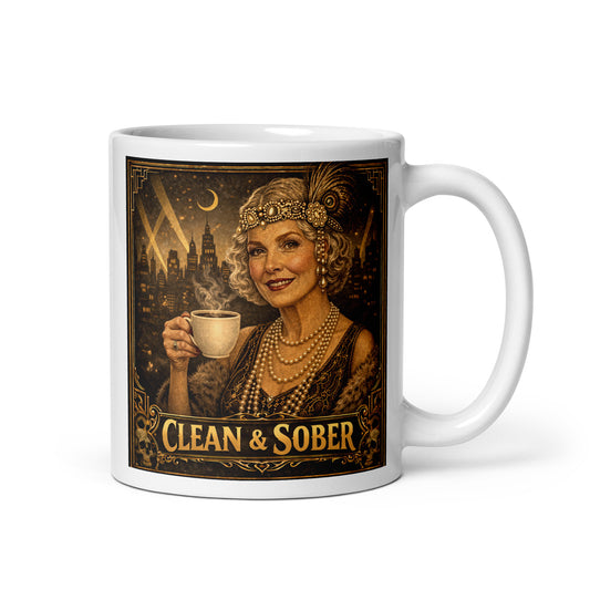 Art Deco style coffee mug featuring a glamorous silver-haired older woman in 1920s flapper attire with pearls, feather headband and fur stole holding a steaming coffee cup against a moonlit city skyline with gold "Clean & Sober" lettering