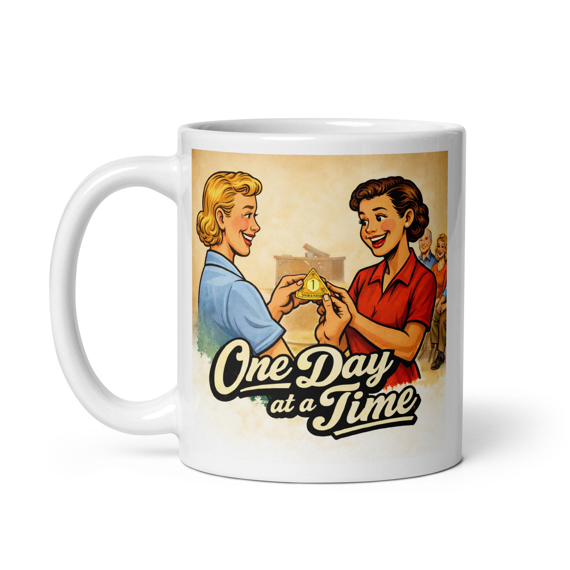 Happy celebration in this 1950s retro one day at a time sobriety coffee mug design featuring two smiling women exchanging a recovery medallion with vintage lettering.