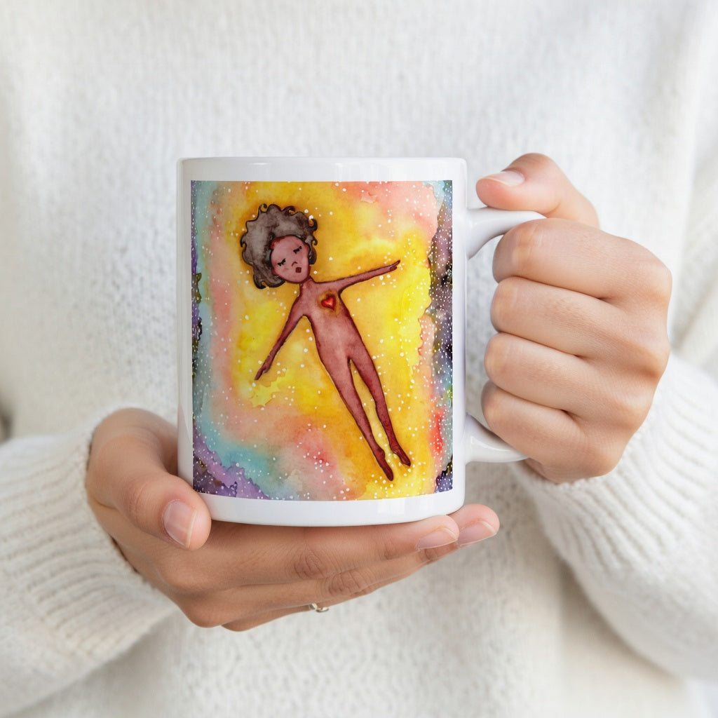 Floating astral body surrounded by glowing energy, spiritual meditation artwork representing consciousness, soul awareness and out-of-body experience, printed on a mindfulness coffee mug. The hands of a person wearing a white sweater are holding the mug up to display the design.