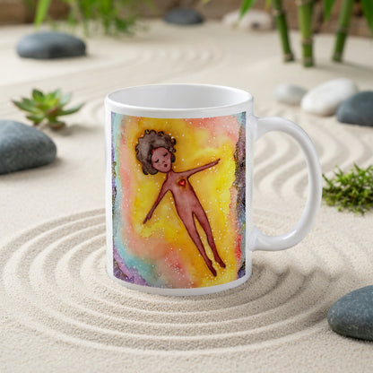 Floating astral body surrounded by glowing energy, spiritual meditation artwork representing consciousness, soul awareness and out-of-body experience, printed on a mindfulness coffee mug.  The mug is in a beautifully raked zen garden with bushes and plants behind it.