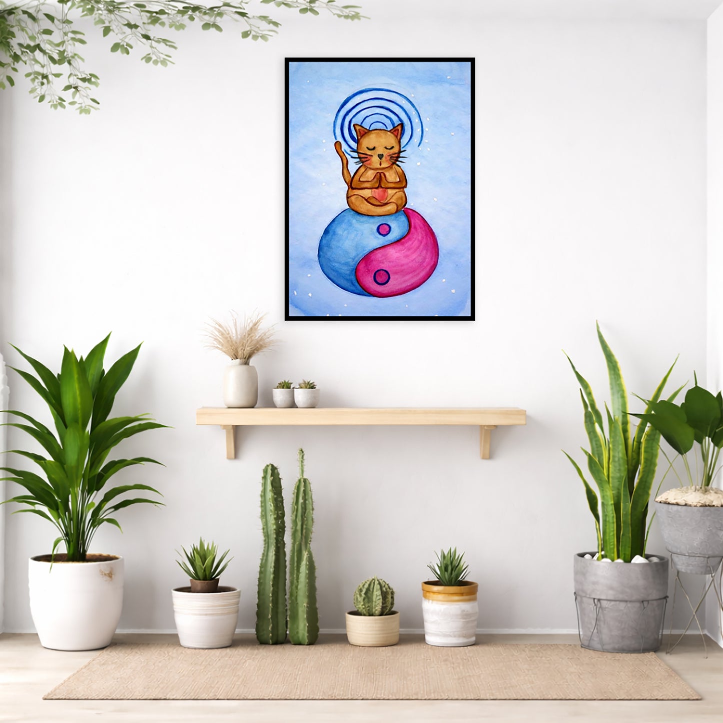 Brown cat meditating on a yin yang symbol with its crown chakra glowing framed poster.  This is a print of the original hand-painted watercolor by Brazilian artist Thaís Suizo.  The poster is in the center of the living room wall. Below the poster is an empty bench. Below the bench is a variety of green potted plants including a few cactus.
