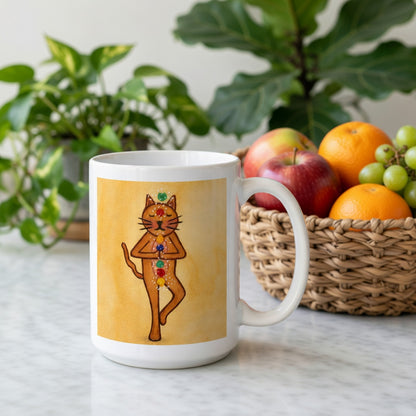 Brown cat standing in a meditation pose with glowing chakras along its body on a yellow background meditation mug. Behind the mug is a basket of fruit and a green potted plant.