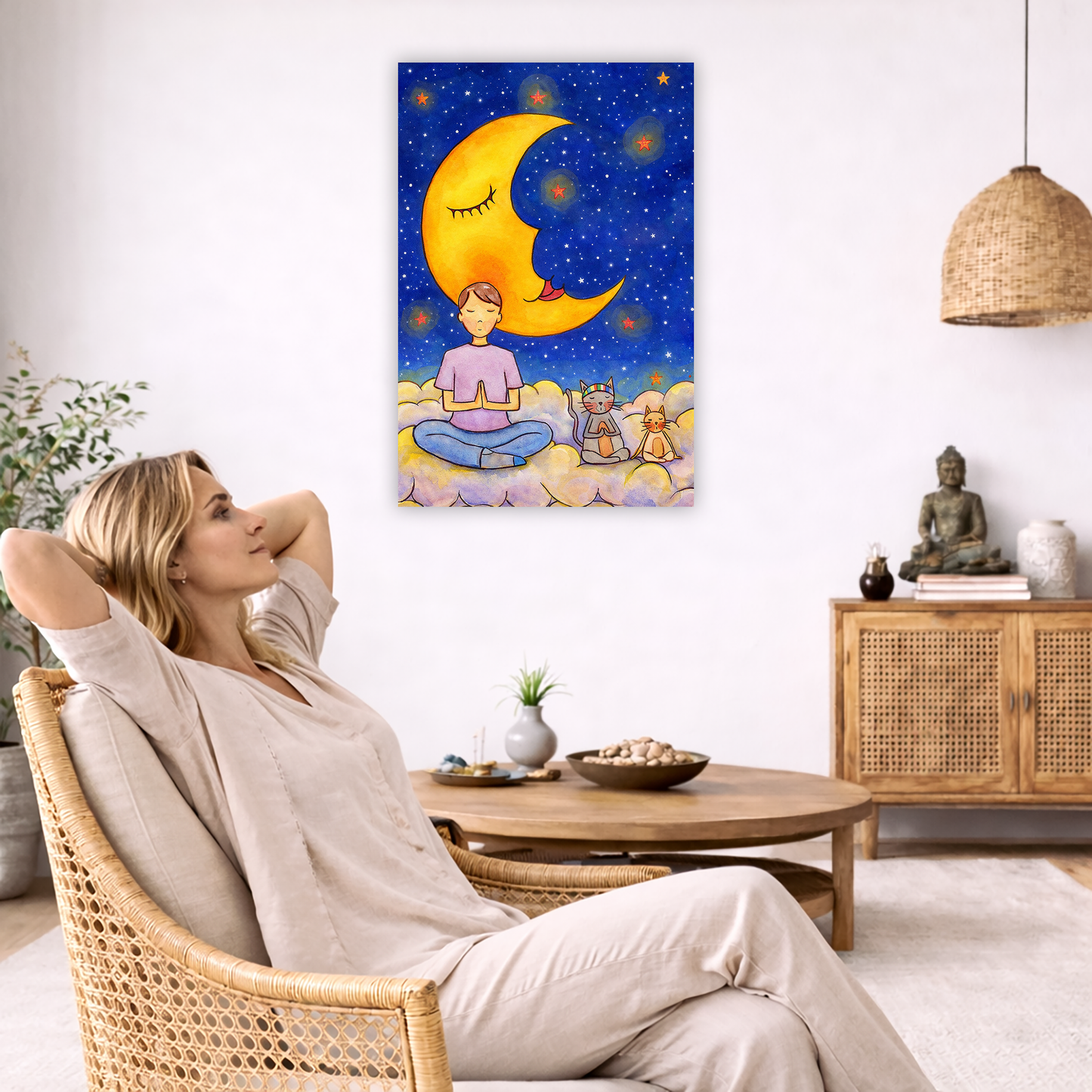 Man and his cats are meditating atop a cloud under the moon in a mindfulness poster.  The canvas is in the center of the living room wall. To the left a woman is relaxing in her chair with her hands behind her head. There is a small coffee table beside her with a bowl of walnuts, incense and a small green plant. On the right side of the room is a cabinet with a Buddha statue, books and an urn on it. To the left is a green floor plant.
