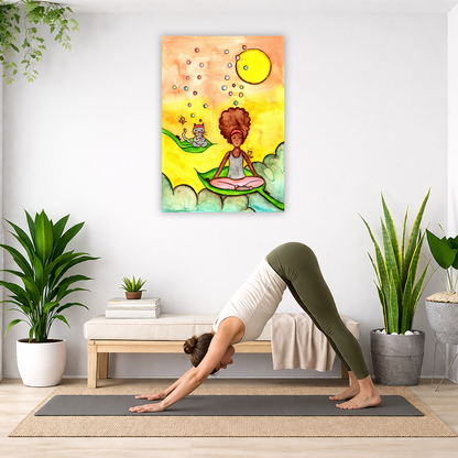Canvas of a woman and her cat meditating while sitting on leaves. The background is bright yellow. The canvas is in the center of the living room wall. Below the poster a woman is doing the yoga posture downward facing dog on a yoga mat.