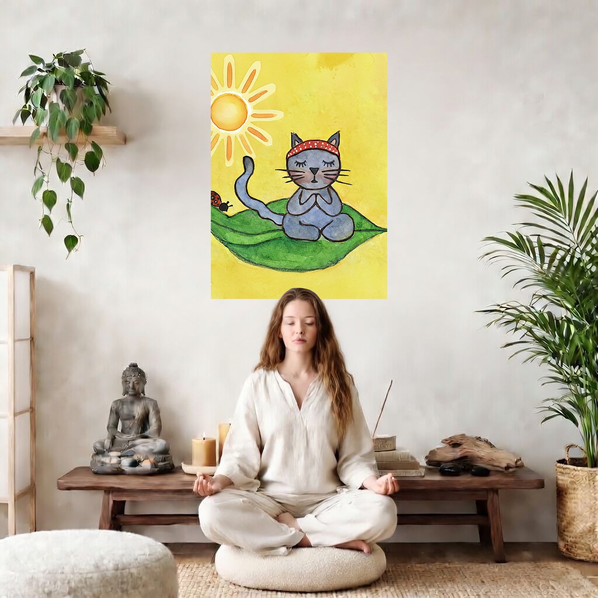 Gray cat meditating on a leaf in sunlight, peaceful nature-inspired mindfulness artwork. The poster is in the center of the living room wall. There is a woman meditating facing away from the wall. Behind her is a coffee table with incense and a Buddha statue. There are potted plants on the right and left side of the background.

