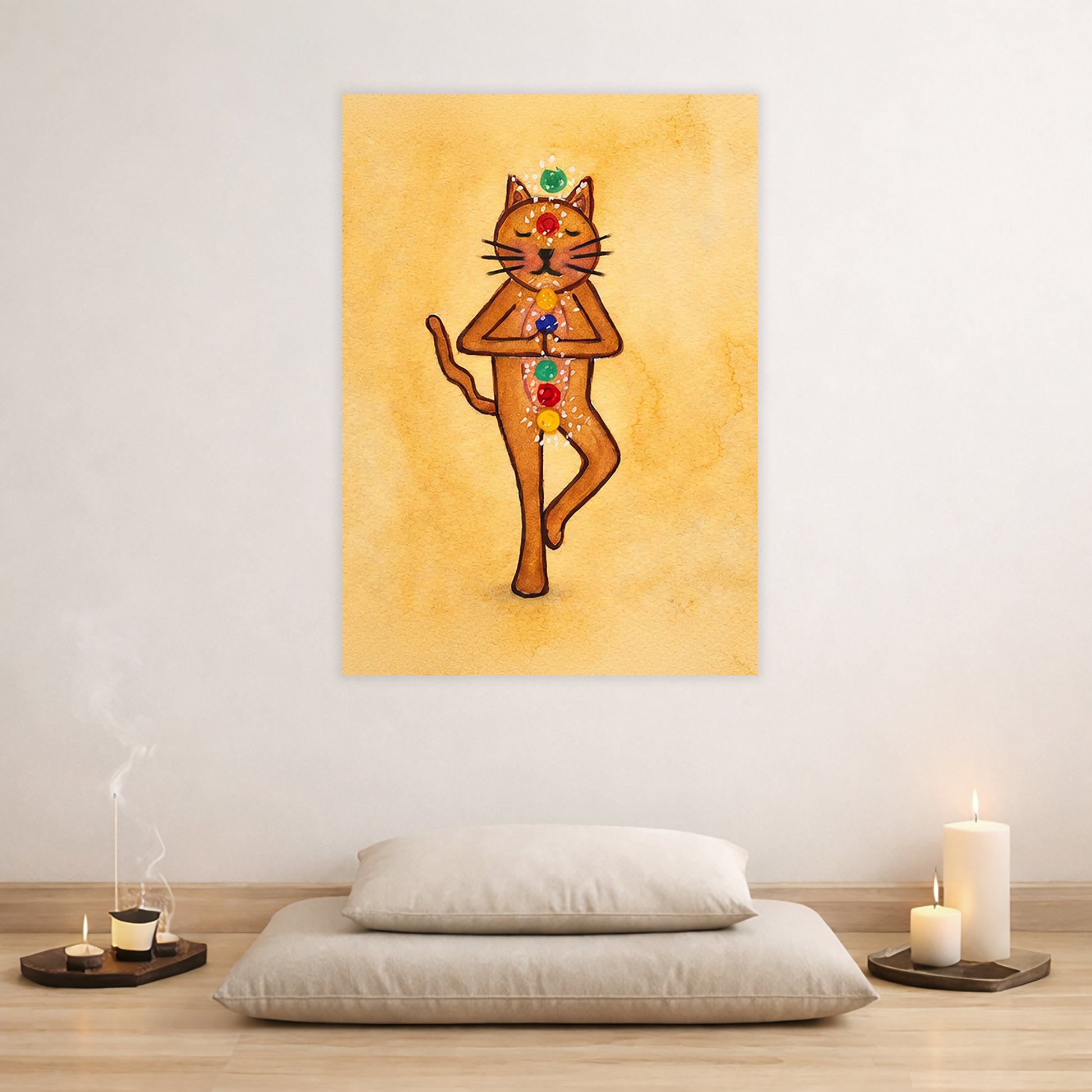 A poster with a brown cat in standing meditation pose with glowing chakras aligned along the body. The poster is in the center of the living room wall. There are two pillows stacked beneath the poster. To the left candles and incense are burning. To the right two candles are burning.
