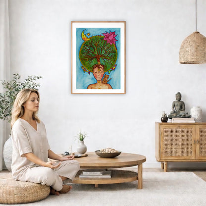 Poster of the crown chakra of a woman opening up like the tree of life. A cat is on her shoulder.  The poster is in the center of the living room wall. A woman is on a chair on the left side of his living room meditating. There is a green potted plant behind her. On the right side is a cabinet with a Buddha statue on it.
