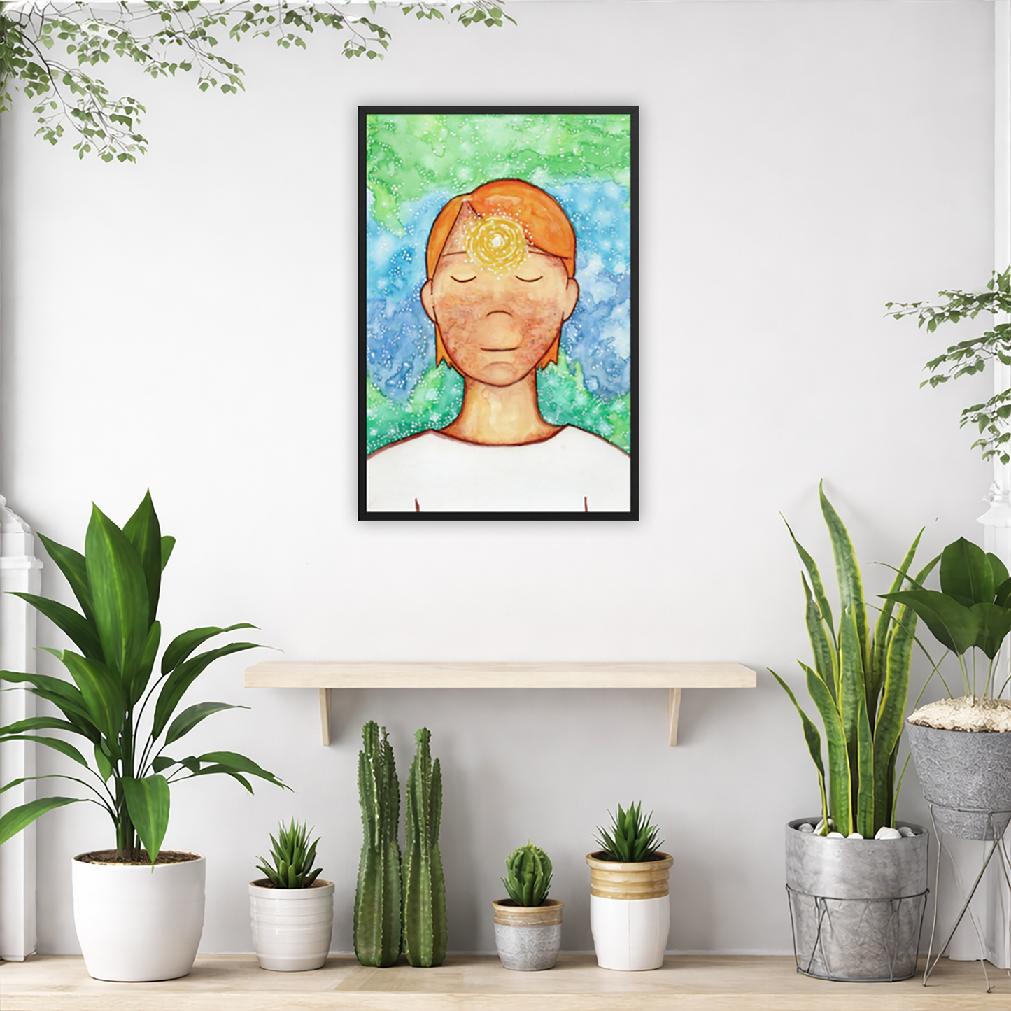 Framed poster of a man with a glowing brow chakra. The poster is in the center of the living room wall. Below the poster is an empty bench. Below the bench is a variety of green potted plants including a few cactus.
