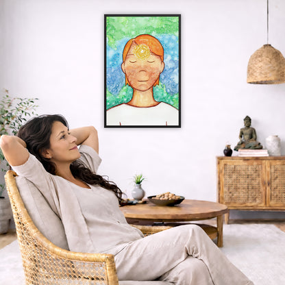 Framed poster of a man with a glowing brow chakra.  The poster is in the center of the living room wall. To the left a woman is relaxing in her chair with her hands behind her head. There is a small coffee table beside her with a bowl of walnuts, incense and a small green plant. On the right side of the room is a cabinet with a Buddha statue, books and an urn on it. To the left is a green floor plant.
