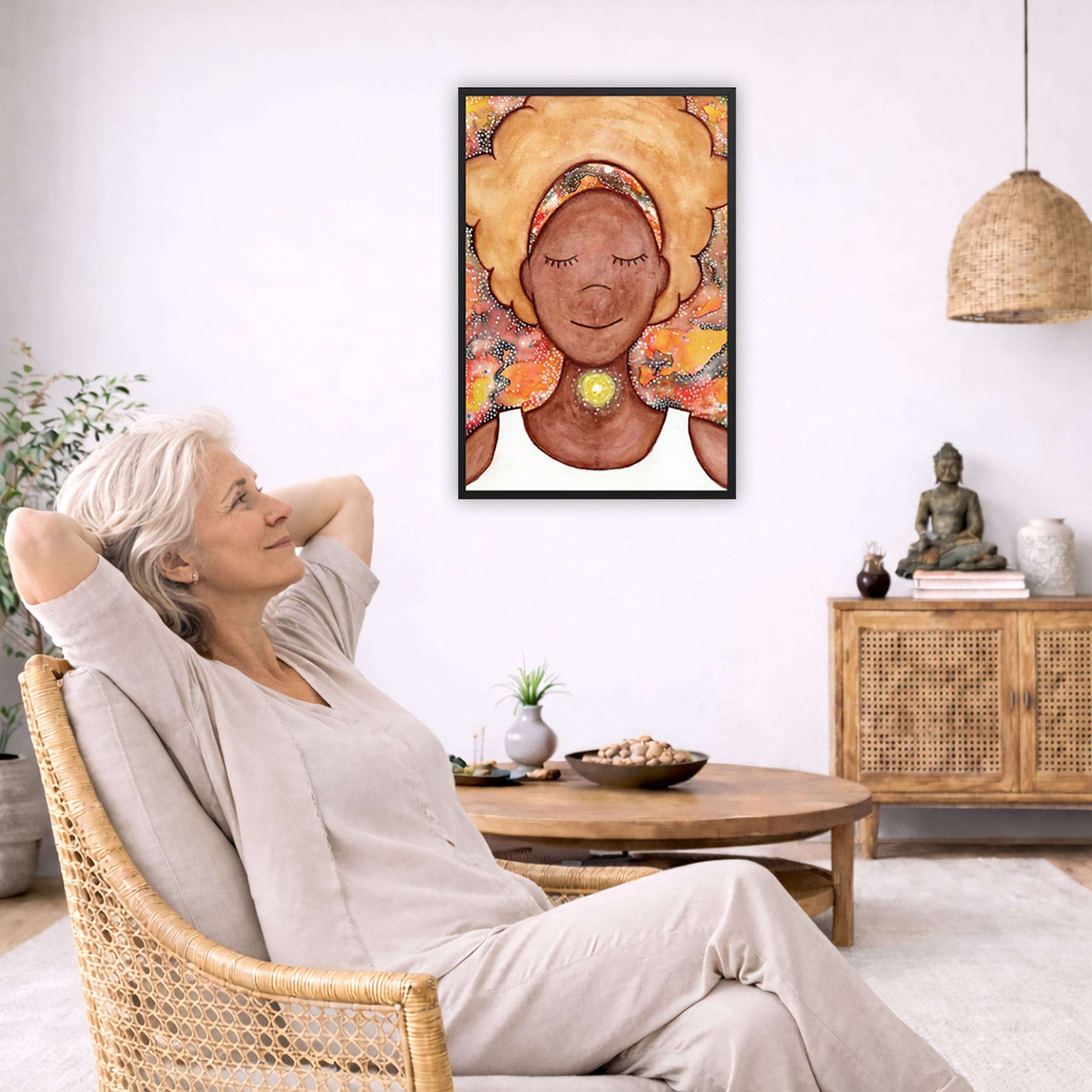 Framed poster of a woman mediating with a glowing throat chakra. The poster is in the center of the living room wall. To the left a woman is relaxing in her chair with her hands behind her head. There is a small coffee table beside her with a bowl of walnuts, incense and a small green plant. On the right side of the room is a cabinet with a Buddha statue, books and an urn on it. To the left is a green floor plant.