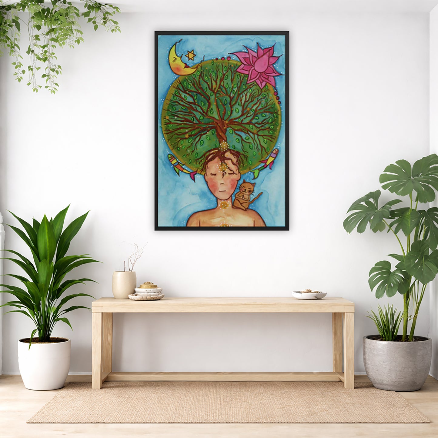 Framed poster of the crown chakra of a woman opening up like the tree of life. A cat is on her shoulder.  The poster is in the center of the living room wall. Below the poster is an empty bench. Below the bench is a variety of green potted plants including a few cactus.
