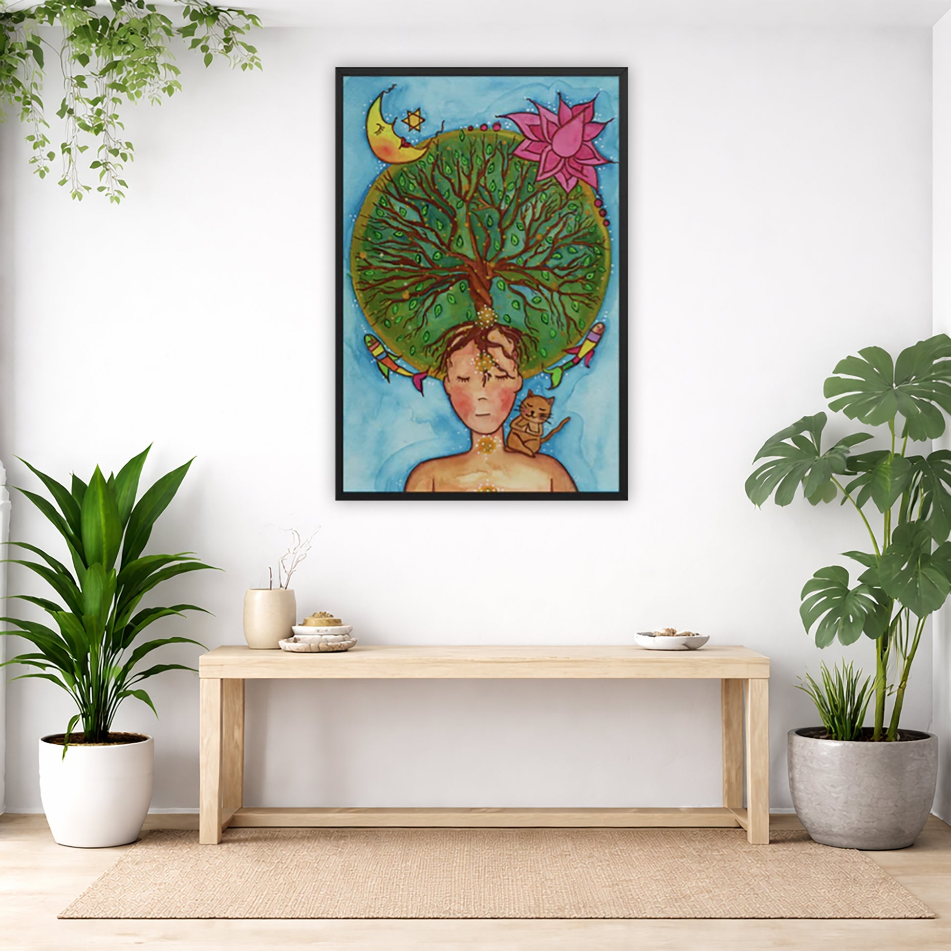 Framed poster of the crown chakra of a woman opening up like the tree of life. A cat is on her shoulder.  The poster is in the center of the living room wall. Below the poster is an empty bench. Below the bench is a variety of green potted plants including a few cactus.
