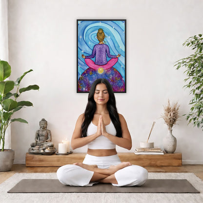 Framed poster of a woman meditating on top of the world with her root chakra glowing.  The poster is in the center of the living room wall. There is a woman meditating facing away from the wall. Behind her is a coffee table with incense and a Buddha statue. There are potted plants on the right and left side of the background.
