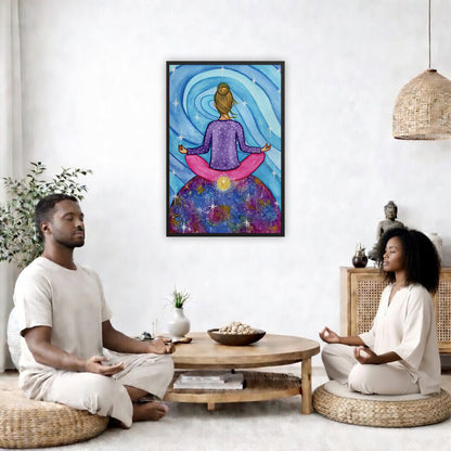 Framed poster of a woman meditating on top of the world with her root chakra glowing. The poster is in the center of the living room wall. Two friends are sitting on wicker pillows meditating. Between them is a small round coffee table with incense, a green potted plant and a bowl of shells. There is a potted plant to the left and a Buddha statue and a vase to the right. 