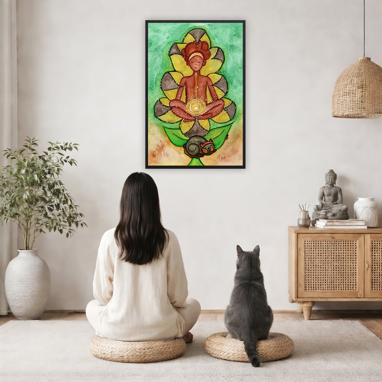 Poster of a woman's sacral chakra glowing and the energy around her.  The poster is in the center of the living room wall. A woman and a cat are staring up at the poster. There is a potted plant on the left side and a cabinet with a Buddha statue, books and incense on the right side. 