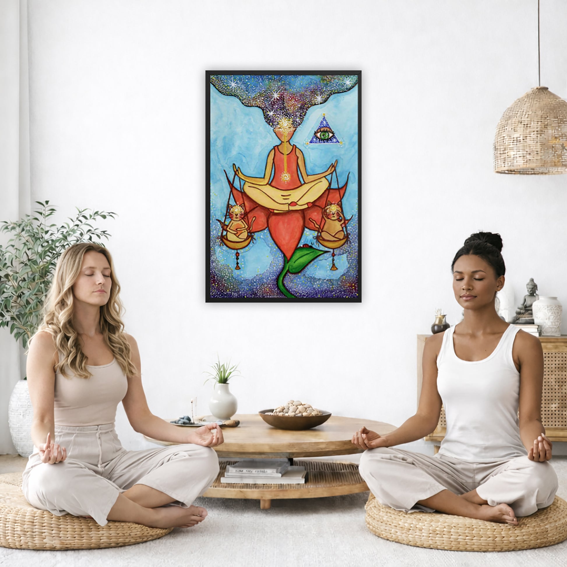 Framed poster of a woman sitting on a lotus with a glowing brow chakra holding a large set of scales.  The poster is in the center of the living room wall. Two women are sitting on a giant pillow having a coffee. Beside them is a small tray with a pot of coffee and incense. To the left is a green floor plant and a hanging green plant. To the right of them is a green floor plant.