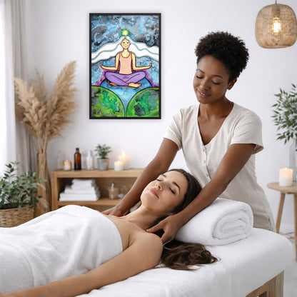 Framed poster of a meditating woman with her crown chakra glowing. The poster is on the wall of the office of a massage therapist. The therapist is giving her female client a massage. The client is lying face up on a massage table wearing a white towel. To the left is a window, floor plant and large vase of dry flora. A shelf is underneath the poster with candles burning. There is a candle burning on a small table and a hanging lamp with a wicker shade on the right side.