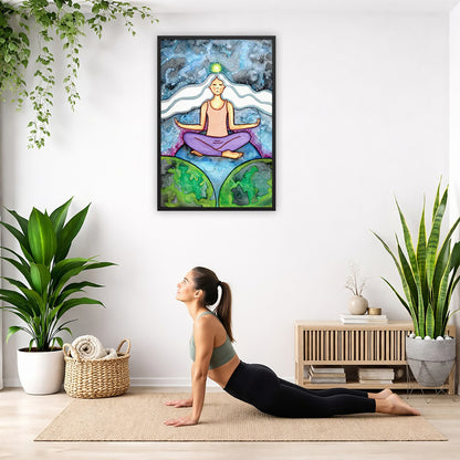 Framed poster of a meditating woman with her crown chakra glowing. The poster is hanging on the wall. A woman on her yoga mat is doing the cobra pose in front of the poster. There is a potted plant and a hanging plant on the left side. A padded bench with material draped over it is behind her. On the right side are two potted plants.
