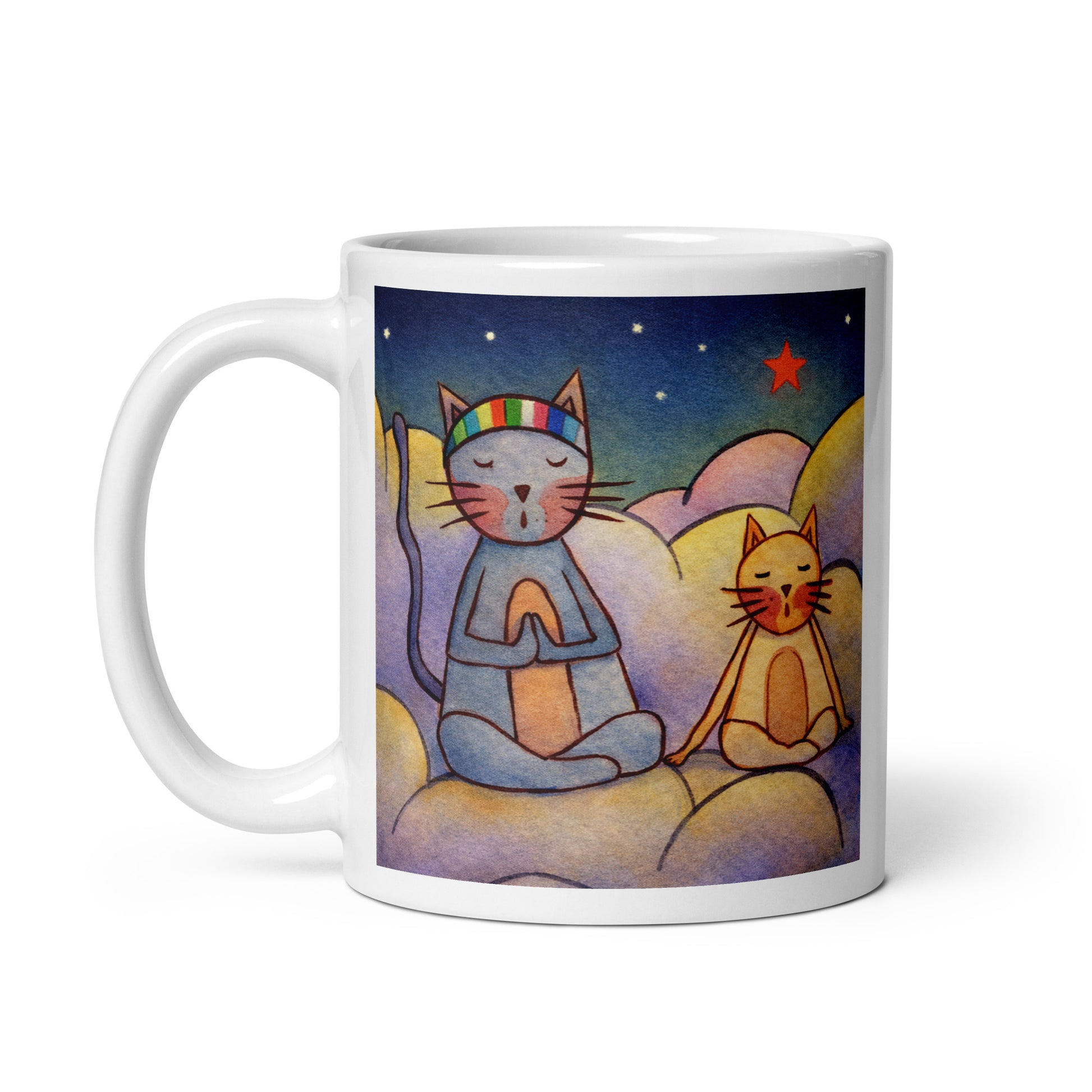 Two cats meditating on a cloud under the night sky mindfulness mug. This illustration of a cat meditating is on both sides of the mug. In this image the handle of the mug is on the right side.