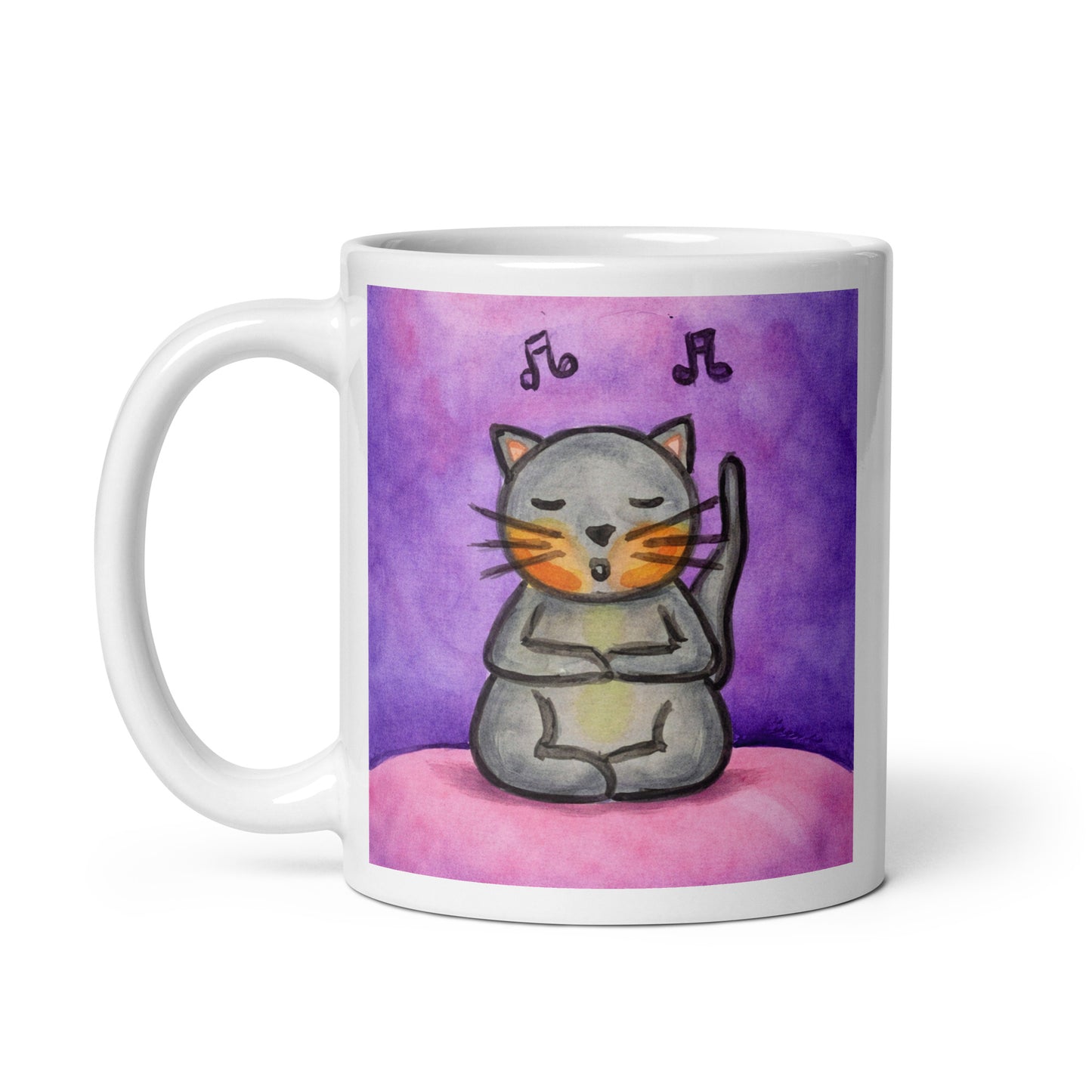 A gray cat is listening to music and chanting on a pink background with notes floating in the air mug. This illustration of a cat meditating is on both sides of the mug. In this image the handle of the mug is on the left side.