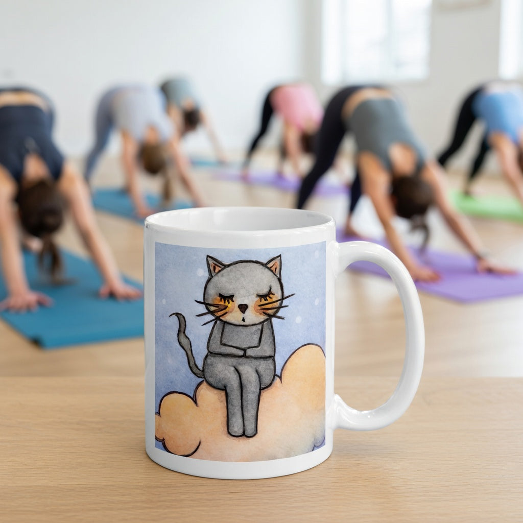 Gray cat Meditating on an orange cloud mindfulness coffee mug. The mug is in front of a yoga class doing the downward facing dog posture.