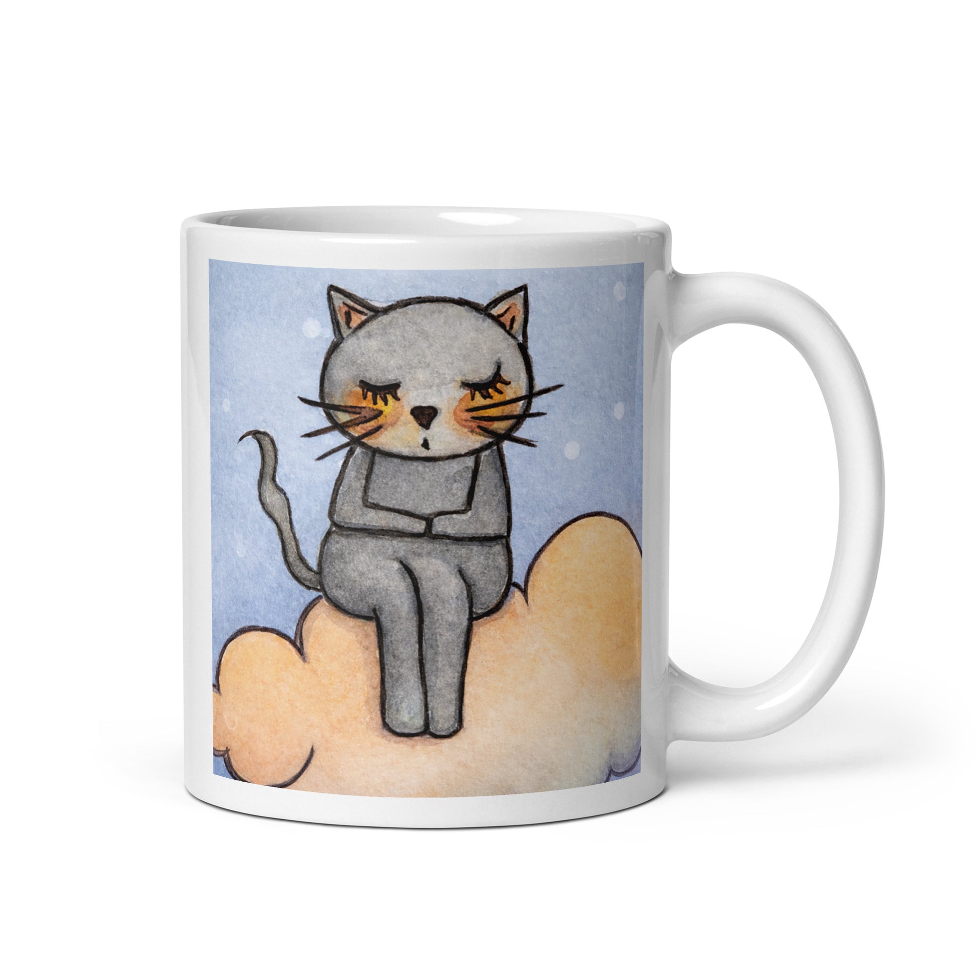 Gray cat Meditating on an orange cloud mindfulness coffee mug. This illustration of a cat meditating is on both sides of the mug. In this image the handle of the mug is on the right side.