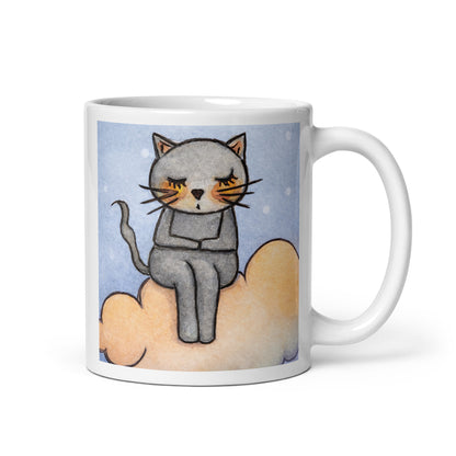 Gray cat Meditating on an orange cloud mindfulness coffee mug. This illustration of a cat meditating is on both sides of the mug. In this image the handle of the mug is on the right side.