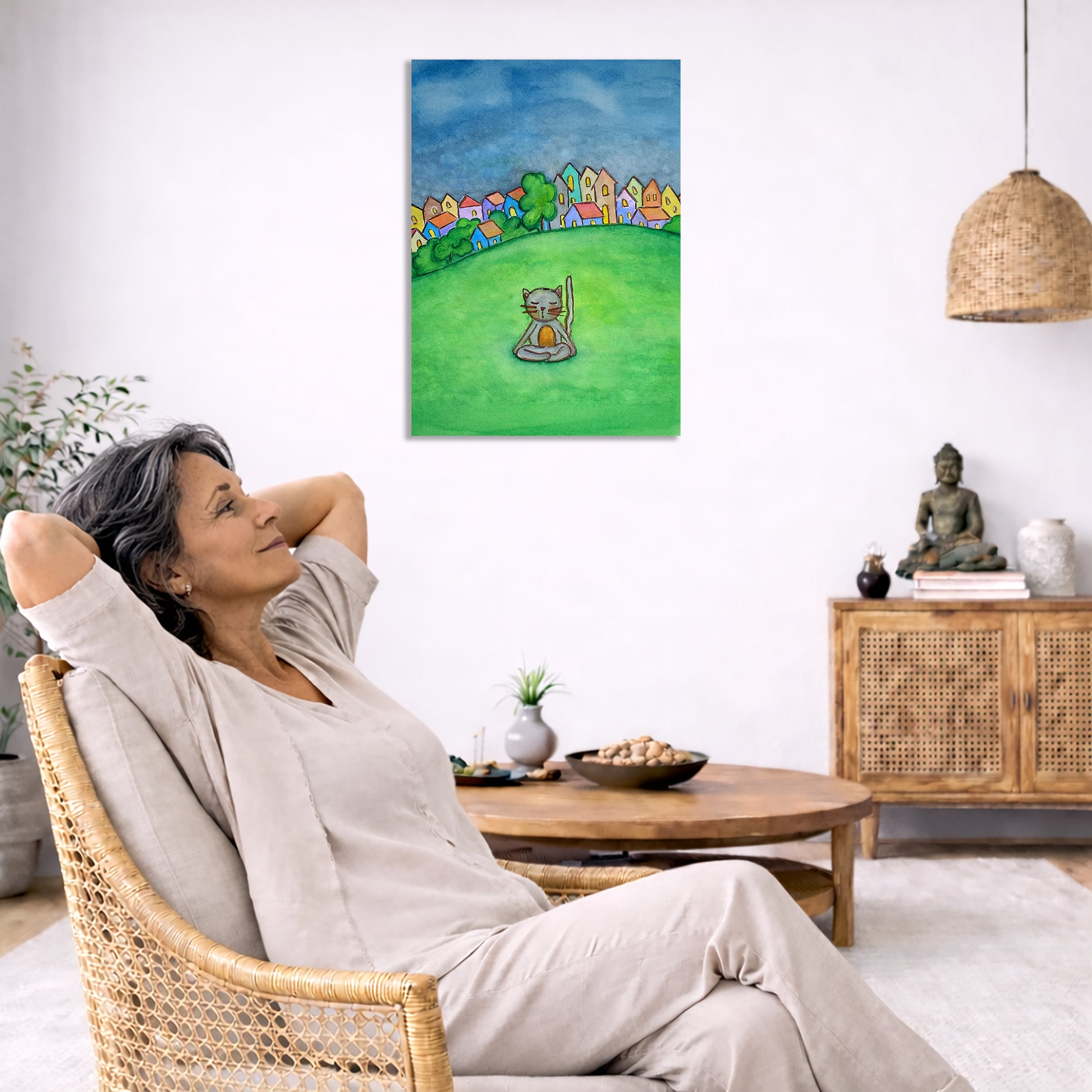 Woman relaxing in a chair with a colorful painting of a garden on the wall above her.