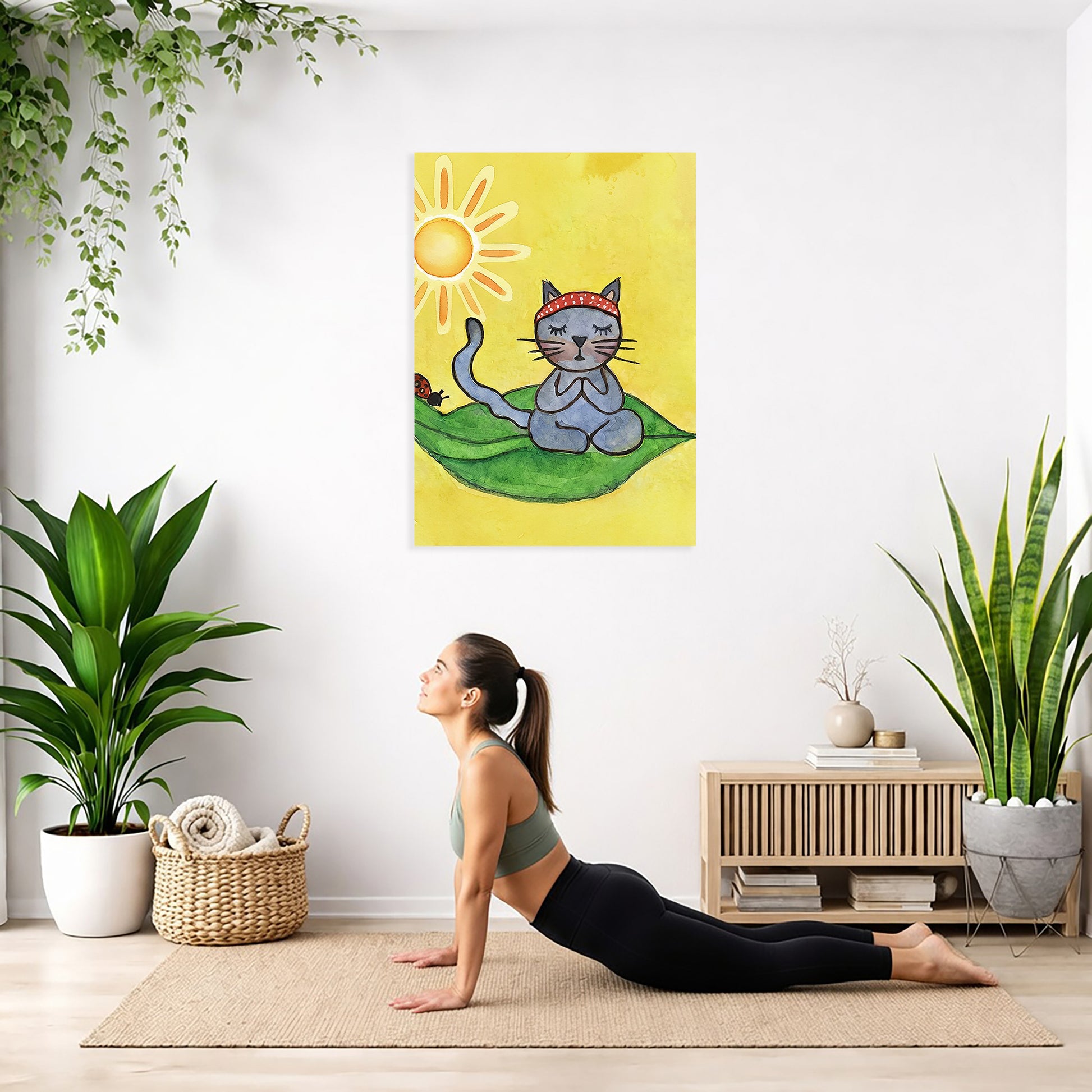 Woman practicing yoga in a room with plants and a wall art of a cat with a sun hat.
