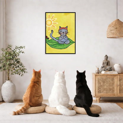 Gray cat meditating on a leaf under a sunny sky framed poster. This is a print of the original hand-painted watercolor by Brazilian artist Thaís Suizo.  Three friends are sitting on wicker pillows meditating in a living room. The poster framed is on the wall behind them. The table behind them has a Buddha statue and a lit candle. There is a white curtain to the left and a hanging lamp and a potted green plant on the right.