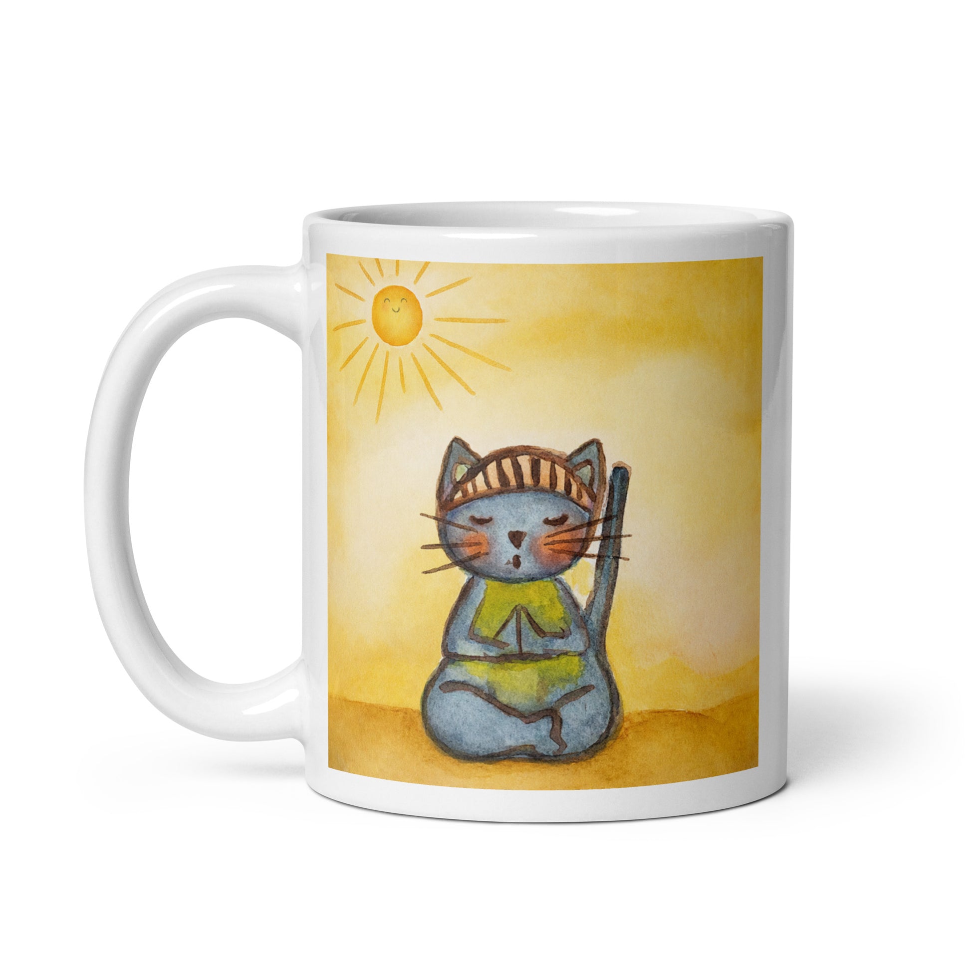 Gray cat meditating on a sunny day mindfulness mug. This illustration of a cat meditating is on both sides of the mug. In this image the handle of the mug is on the left side.