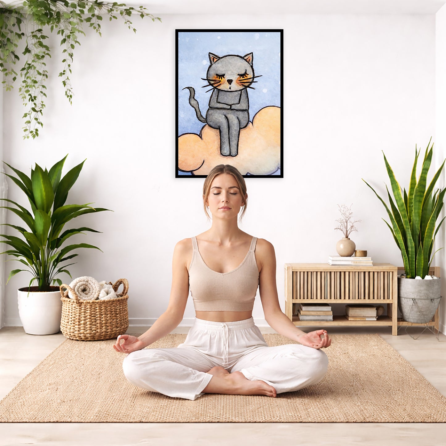 A gray cat meditating on an orange cloud framed poster. This is a print of the original hand-painted watercolor by Brazilian artist Thaís Suizo. The poster is in the center of the living room wall. There is a woman meditating facing away from the wall. Behind her is a coffee table with incense and a Buddha statue. There are potted plants on the right and left side of the background.
