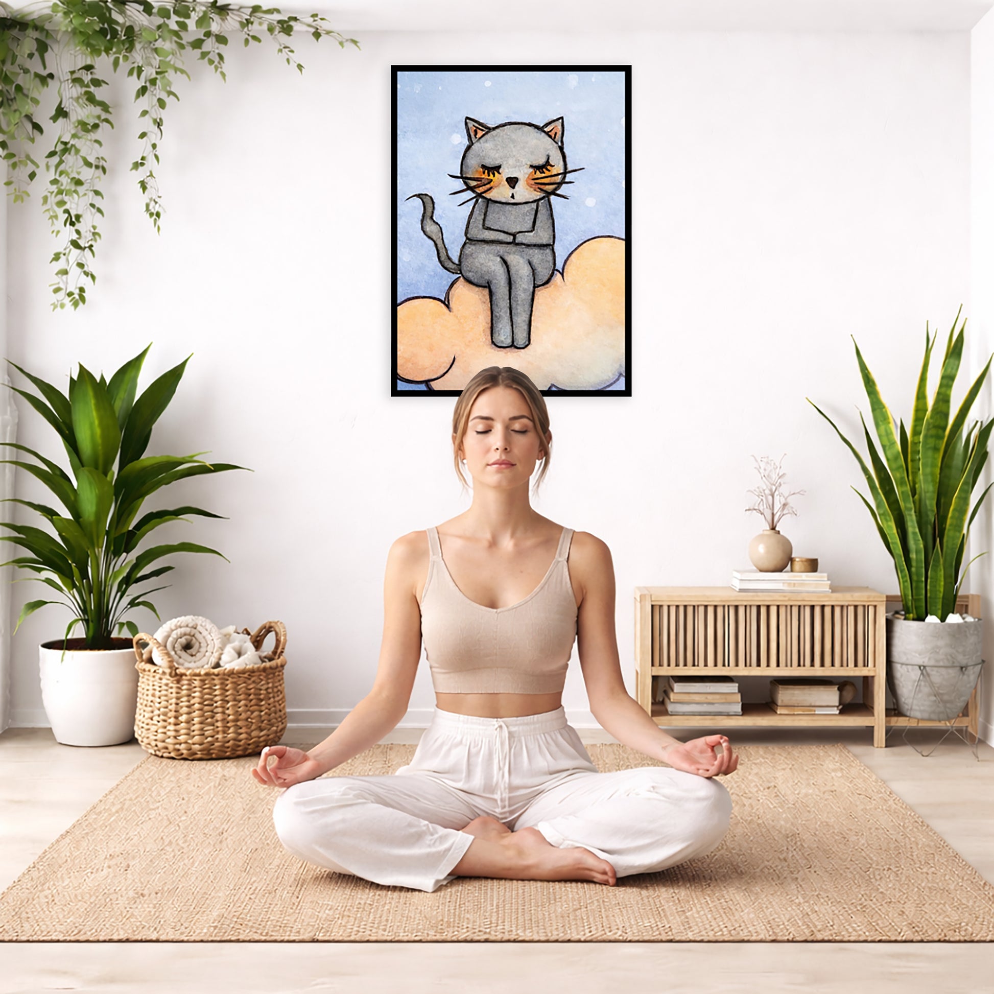 A gray cat meditating on an orange cloud framed poster. This is a print of the original hand-painted watercolor by Brazilian artist Thaís Suizo. The poster is in the center of the living room wall. There is a woman meditating facing away from the wall. Behind her is a coffee table with incense and a Buddha statue. There are potted plants on the right and left side of the background.
