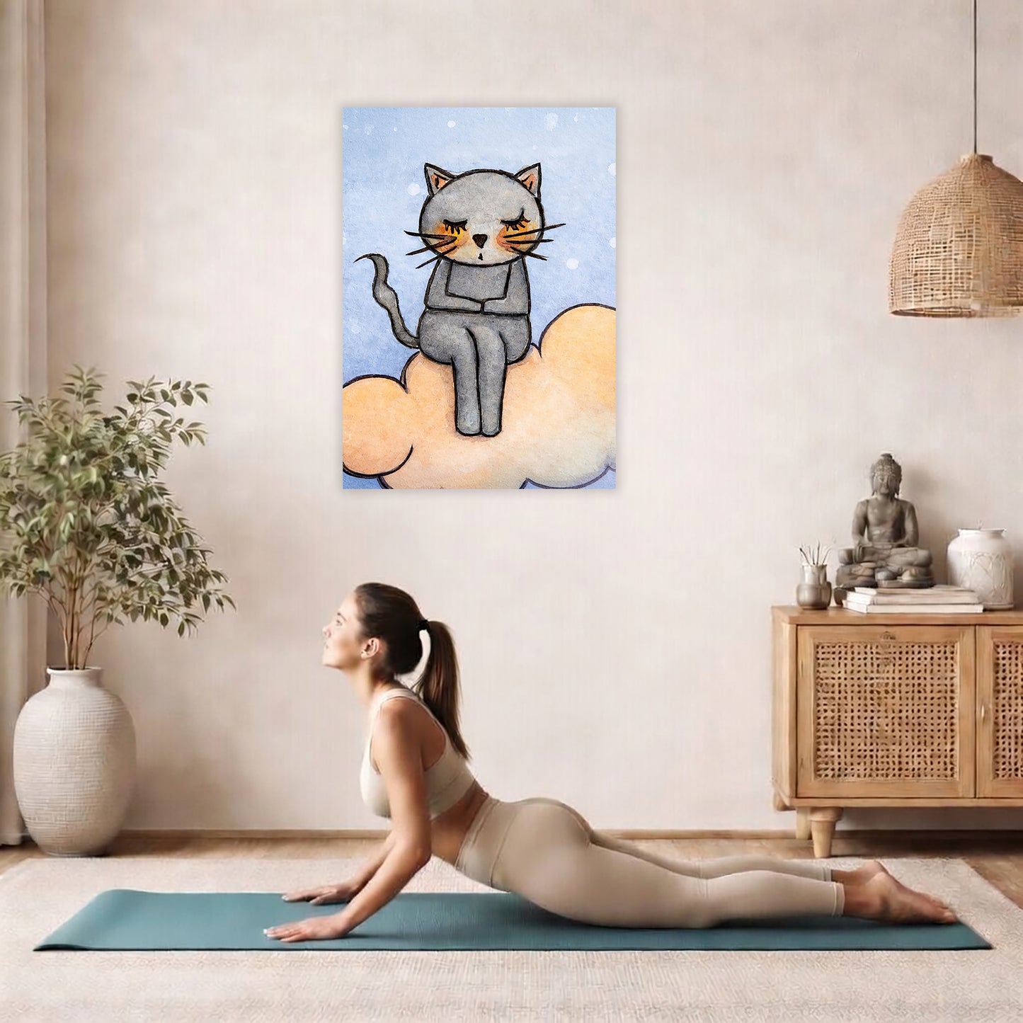 Gray cat meditating on a glowing orange cloud in a calm, warm-toned scene.  The poster is hanging on the wall. A woman on her yoga mat is doing the cobra pose in front of the poster. here is a potted plant on the left side and a cabinet with a Buddha statue on it on the right side.
