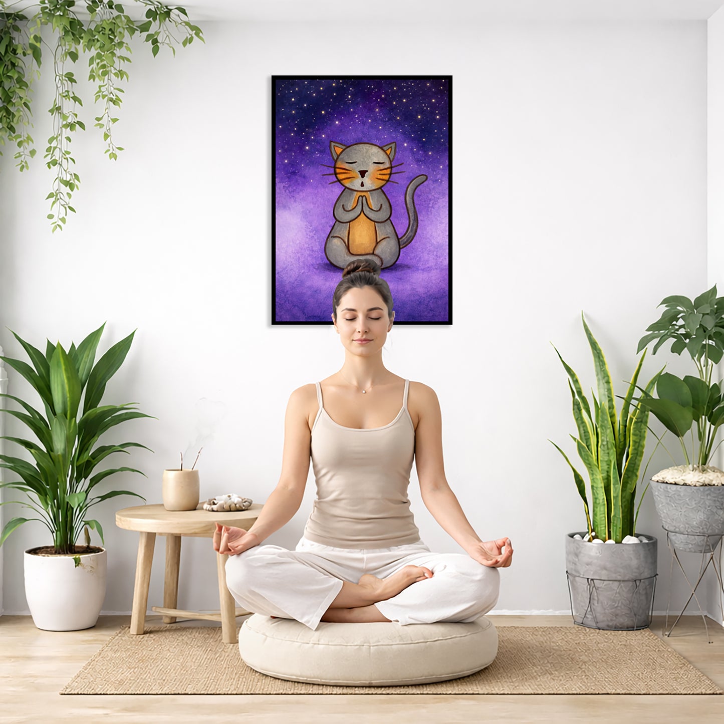 A gray cat meditating under the stars framed poster. This is a print of the original hand-painted watercolor by Brazilian artist Thaís Suizo.  There is a woman meditating on a pillow facing away from the wall. There is a small table beside her with incense and meditation stones. There are potted plants on the right and left side of the background.
