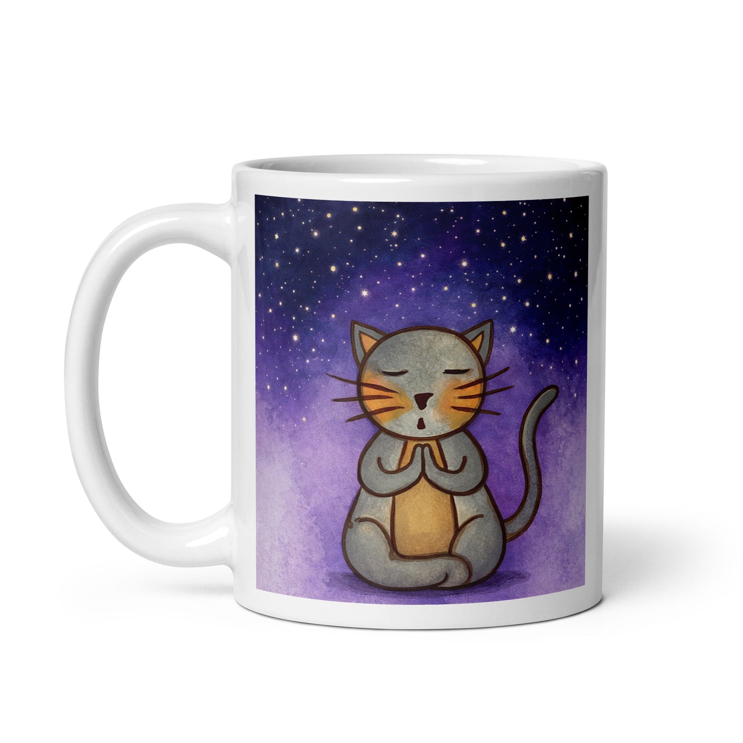 Gray cat meditating under a starry night sky with a peaceful mindfulness coffee mug. This illustration of a cat meditating is on both sides of the mug. In this image the handle of the mug is on the left side.