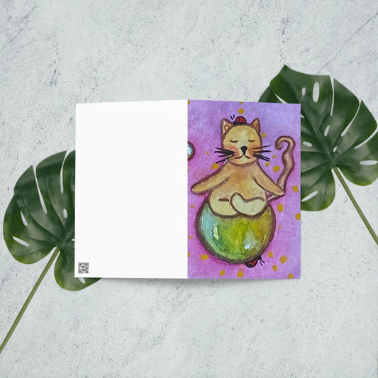 Greeting Card (brown cat meditating on a small planet)