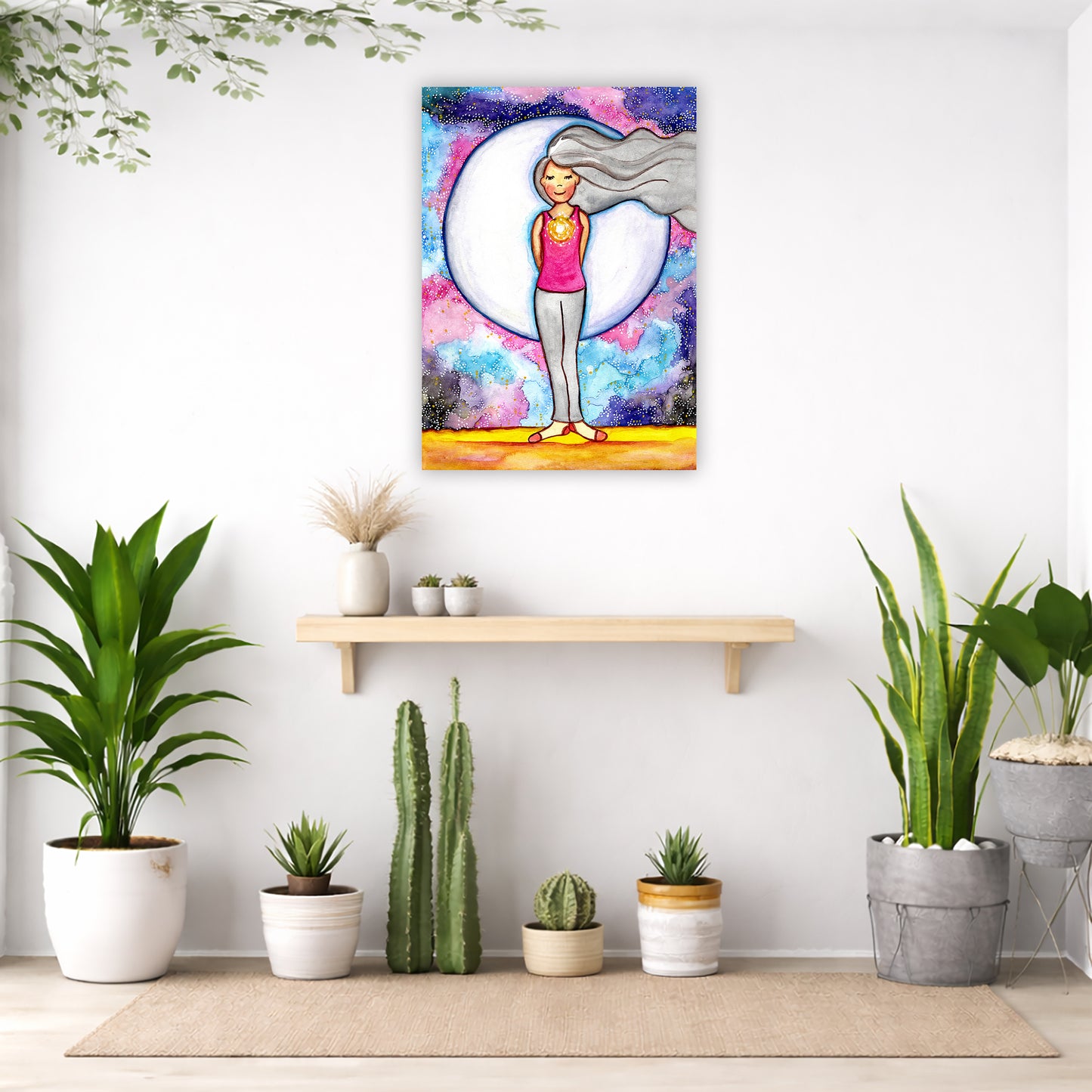 Heart chakra glowing canvas print displayed on a living room wall above a sofa, meditation wall art in warm home setting
