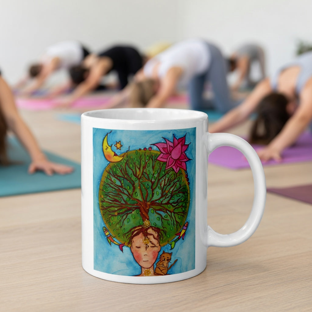 Poster of the crown chakra of a woman opening up like the tree of life.  The mug is in front of a yoga class doing the downward facing dog posture.