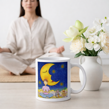 Man and his cats are meditating atop a cloud under the moon in a mindfulness poster.  The mug is on the floor at the bottom center of the image. In the background a woman is meditating. Beside the mug is a vase of flowers.